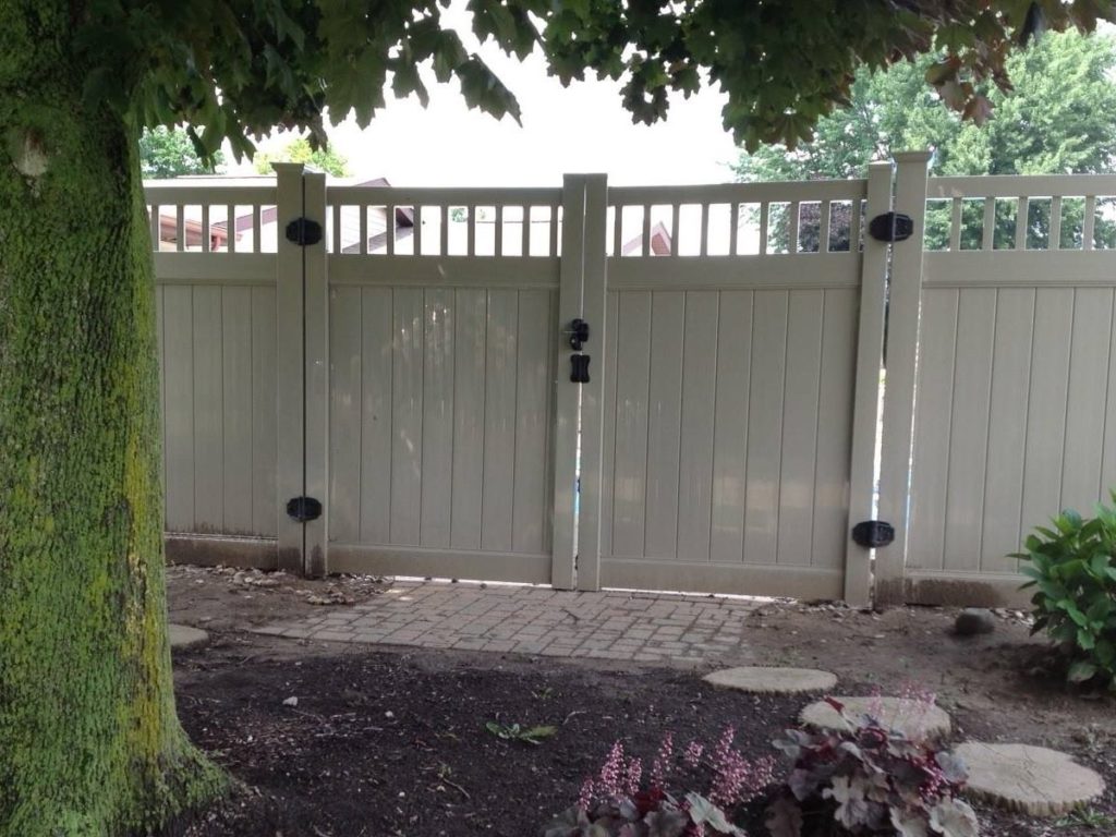 White vinyl fence in shade